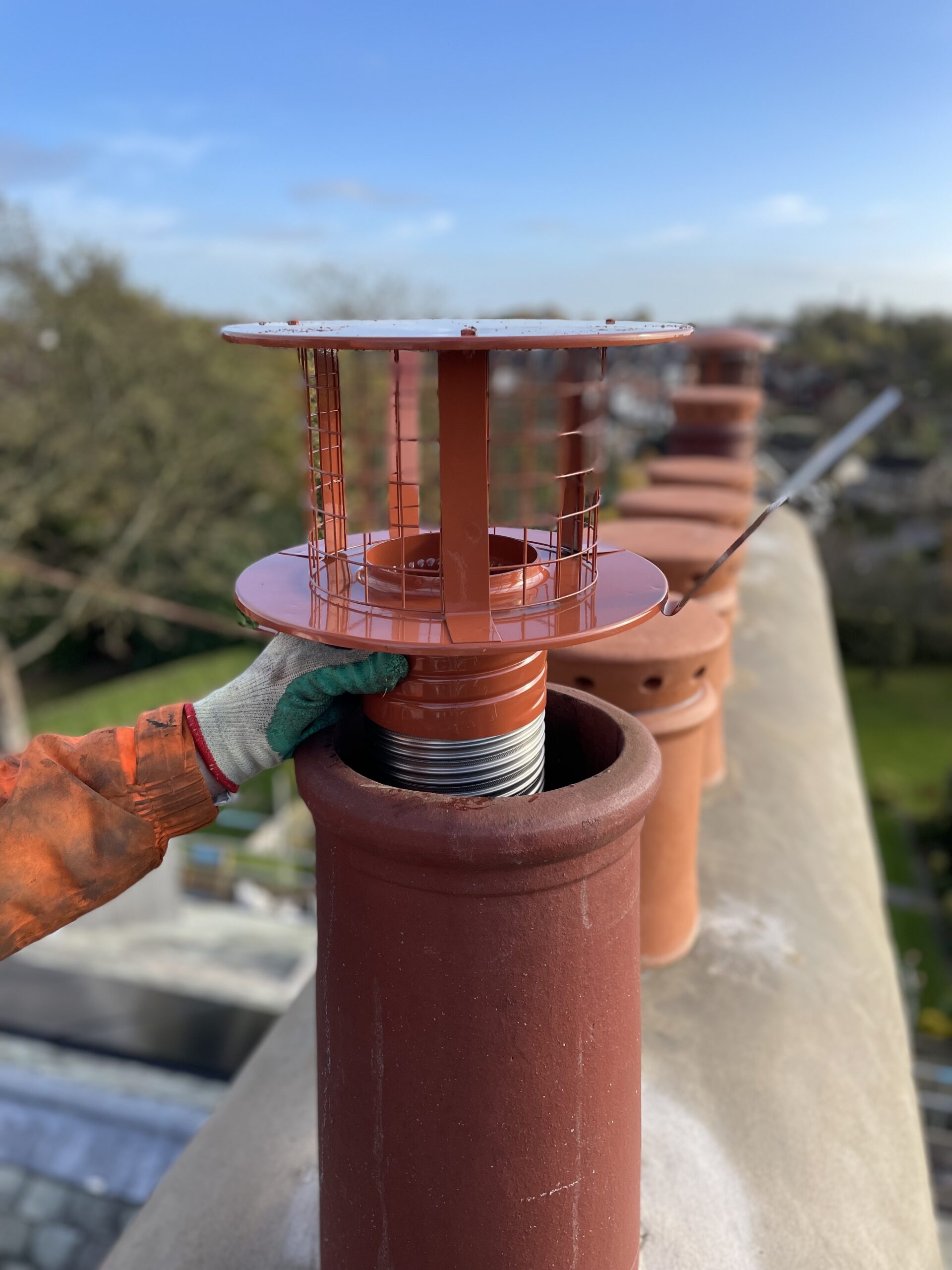 Chimney pots and cowls fitted on chimney
