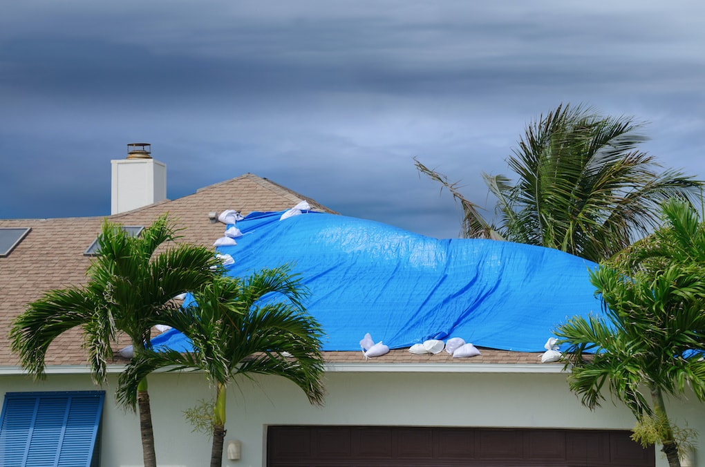 Tarpaulin covering emergency roof damage