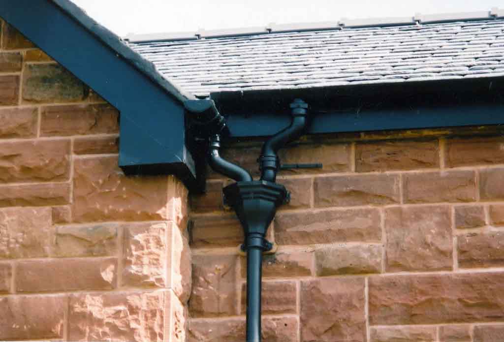 Black cast iron guttering on period property